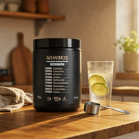 ARMINOS tub on a sunlit kitchen counter with a glass of lime water and a measuring scoop
